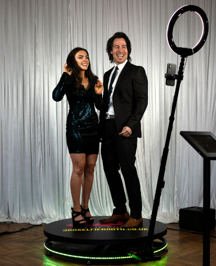 Couple using the 360 Photo booth at an event in Sydney